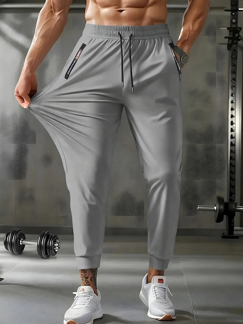 Men's lightweight, stretchy, quick-drying sports pants with zipper pockets
