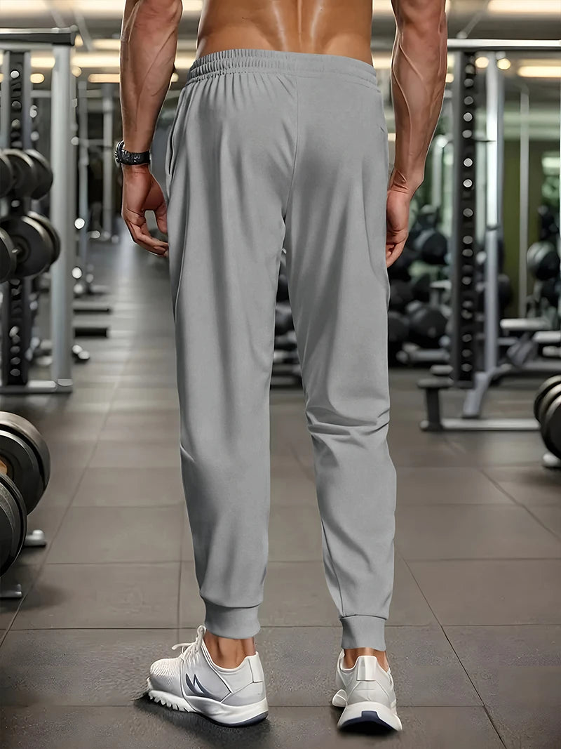 Men's lightweight, stretchy, quick-drying sports pants with zipper pockets